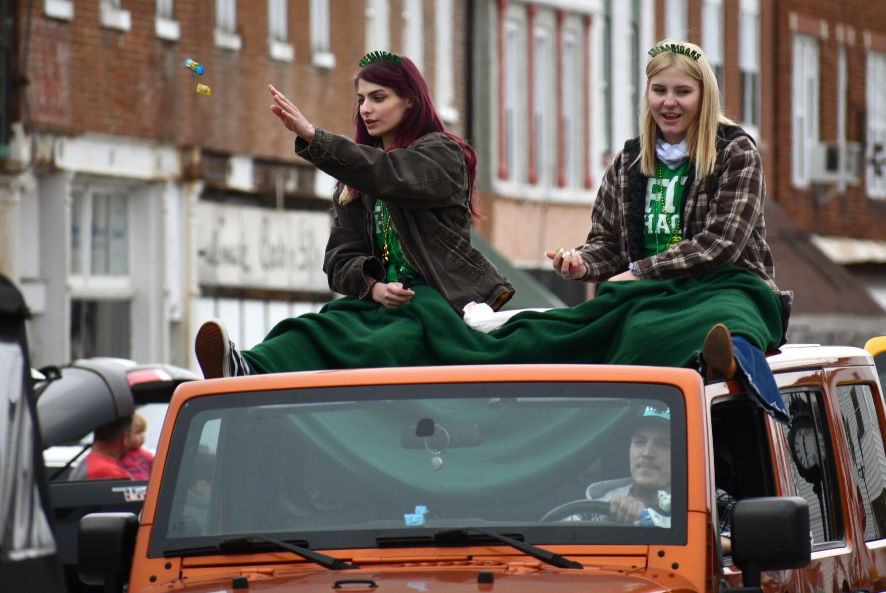 Two women toss candy